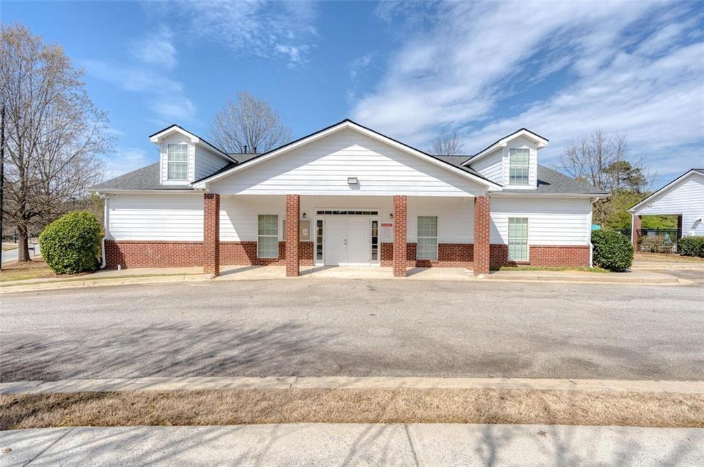 4304 Defoors Farm Trail Powder Springs, GA 30127 - Photo 39 of 41 a front view of a house with a yard and garage