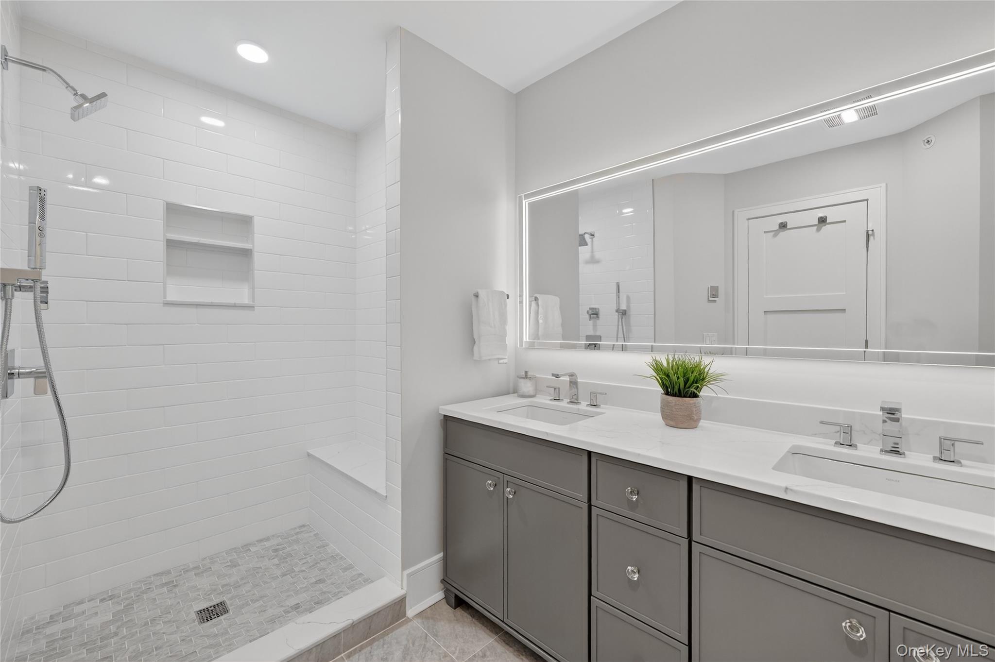 1801 Soundview Court Yorktown Heights, NY 10598 - Photo 19 of 33 a bathroom with a granite countertop sink mirror and shower