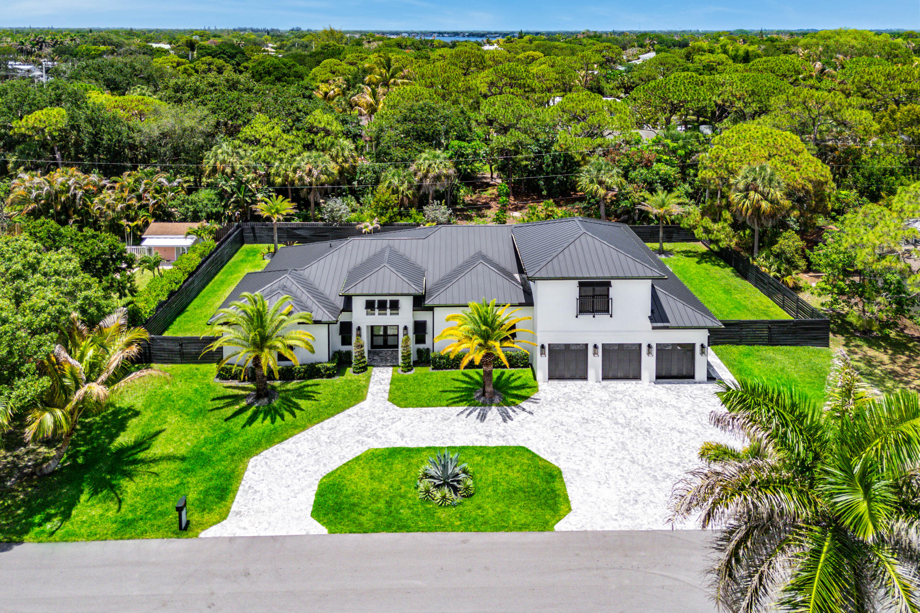 5701 Old Orange Road Jupiter, FL 33458 - Photo 2 of 46 a house with garden in front of it