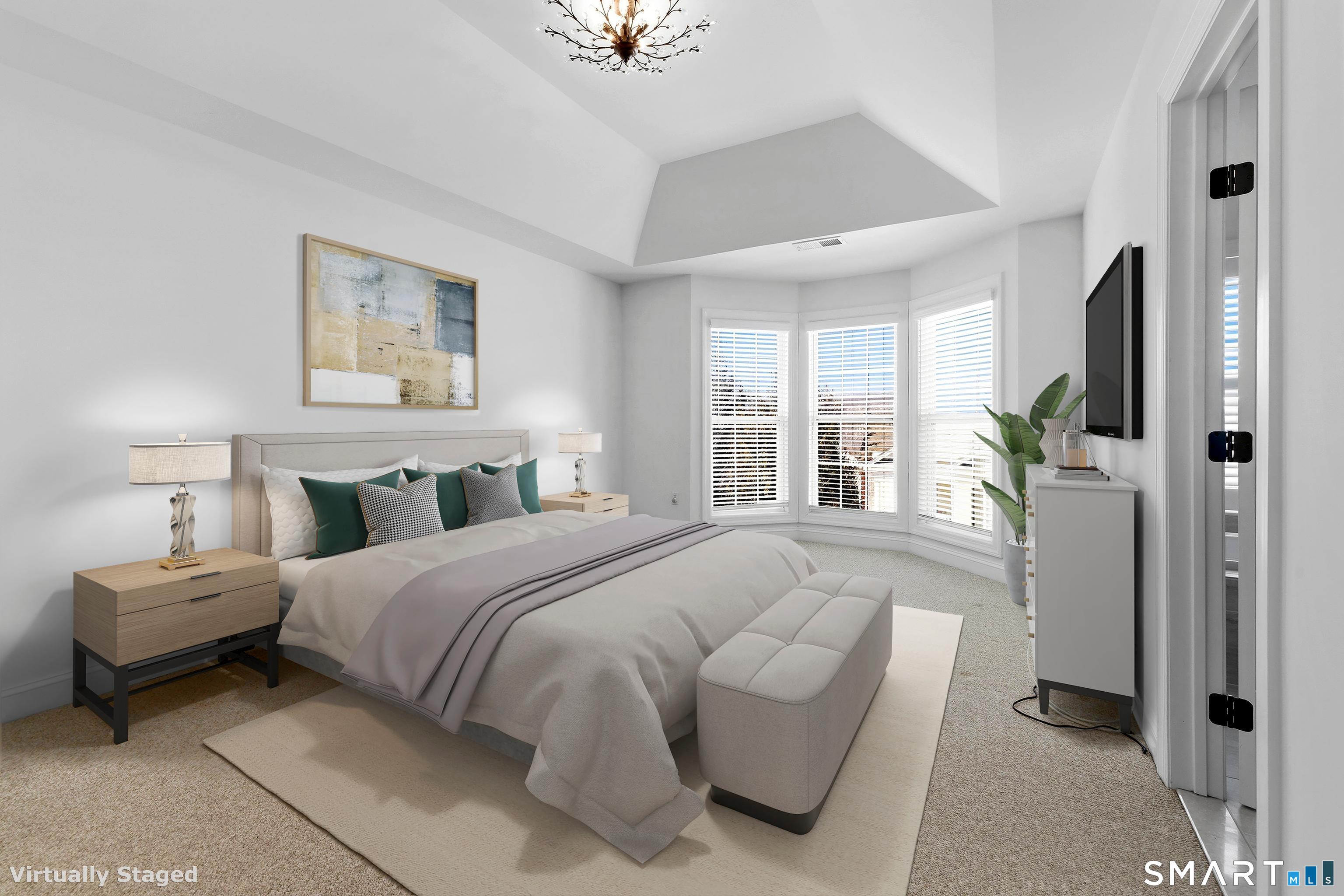 13 Mercy Street, Unit 13 Danbury, CT 06810 - Photo 17 of 40 a spacious bedroom with a bed and a large window