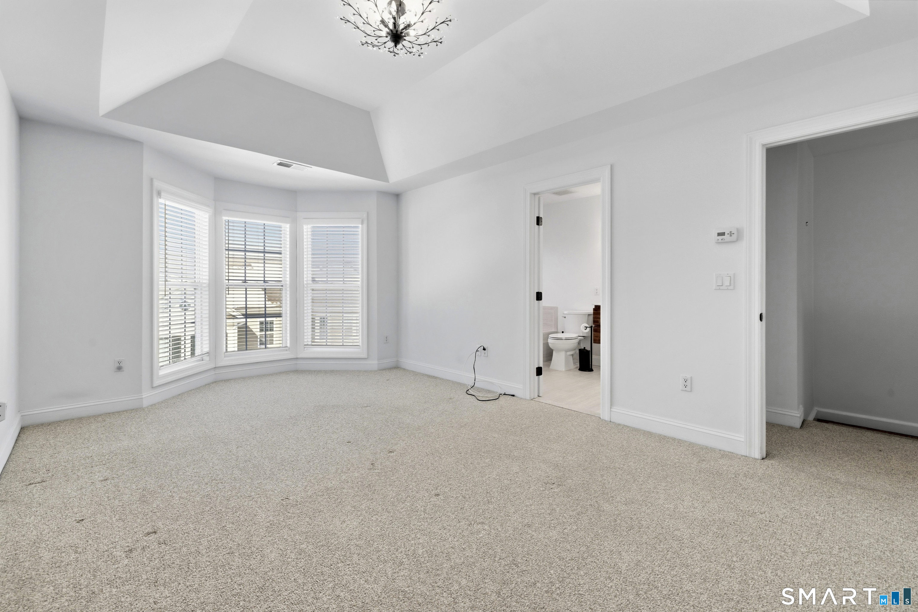 13 Mercy Street, Unit 13 Danbury, CT 06810 - Photo 18 of 40 a view of an empty room with a window