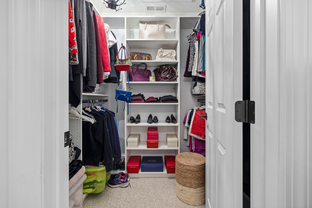 13 Mercy Street, Unit 13 Danbury, CT 06810 - Photo 22 of 40 a view of walk in closet with clothes and shoes