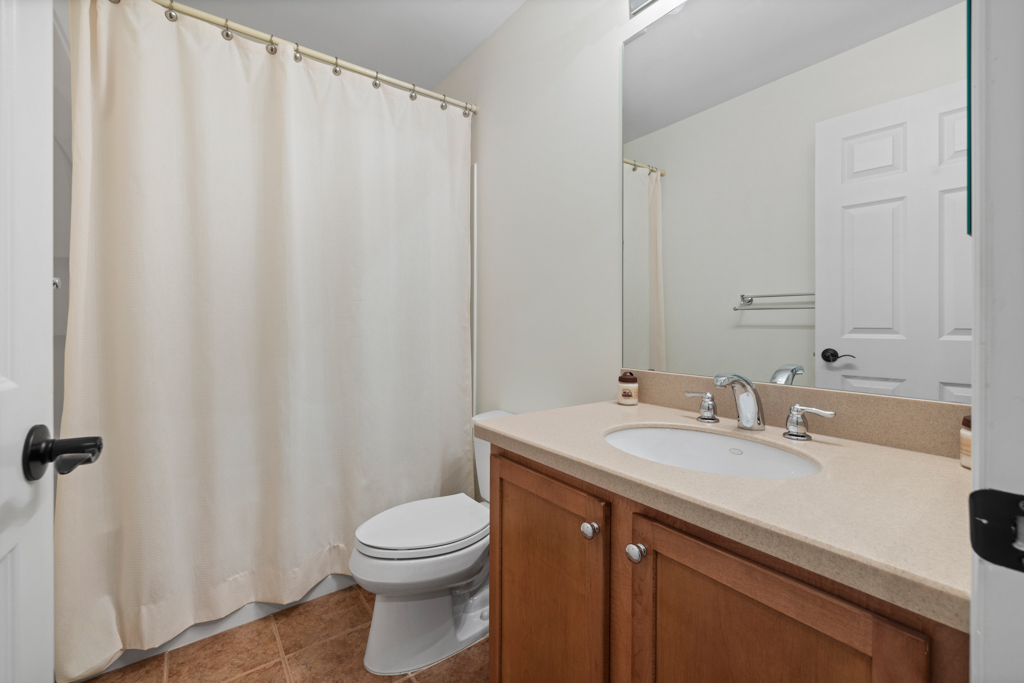 13 Mercy Street, Unit 13 Danbury, CT 06810 - Photo 27 of 40 a bathroom with a sink a toilet and a mirror