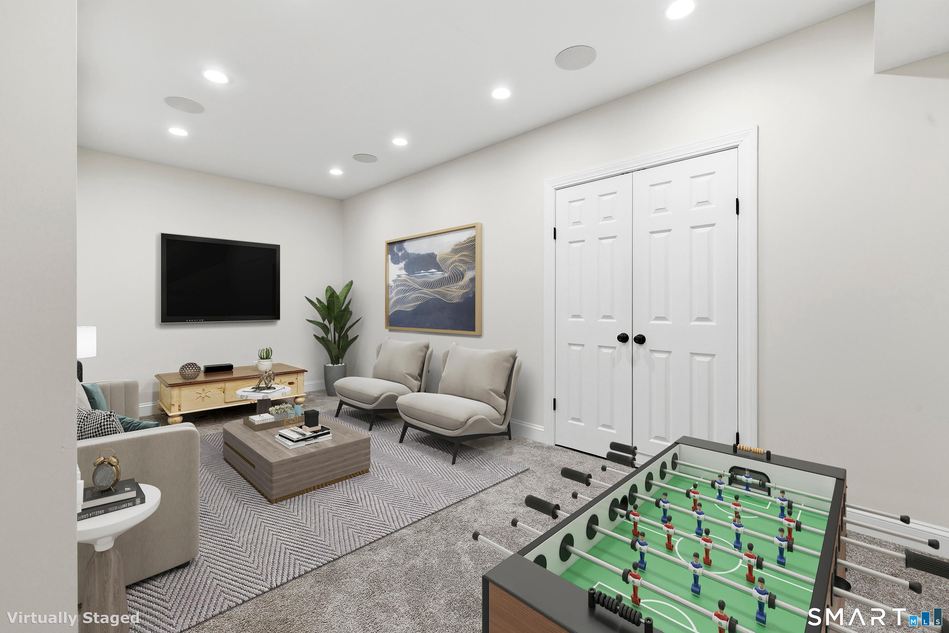 13 Mercy Street, Unit 13 Danbury, CT 06810 - Photo 30 of 40 a living room with furniture and a flat screen tv