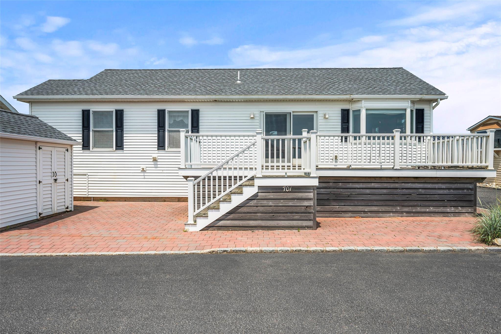 100 Deforest Road, Unit 701 Montauk, NY 11954 - Photo 1 of 1 a view of a house with wooden fence