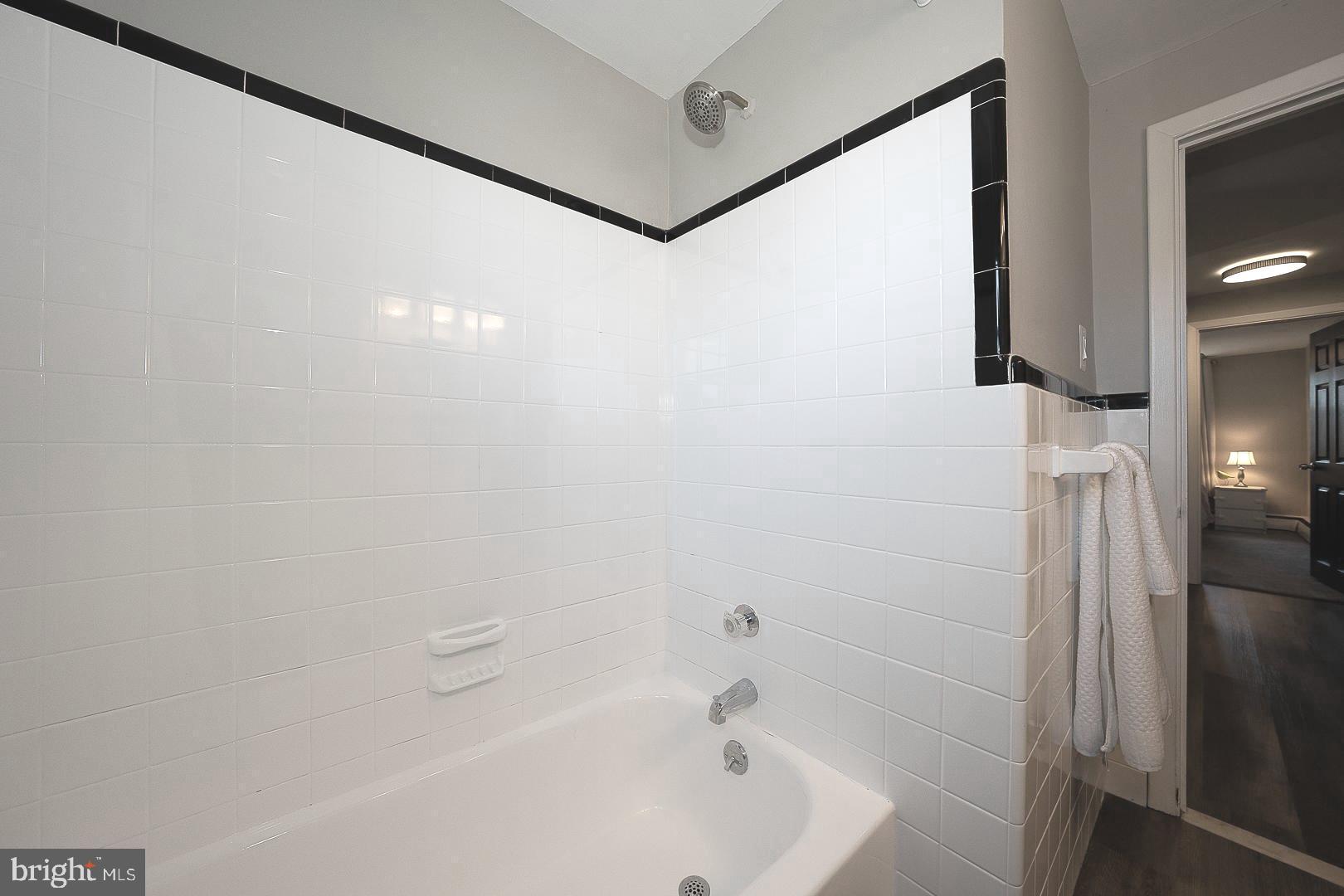334 Parham Road Springfield, PA 19064 - Photo 23 of 45 a bathroom with a bathtub and shower