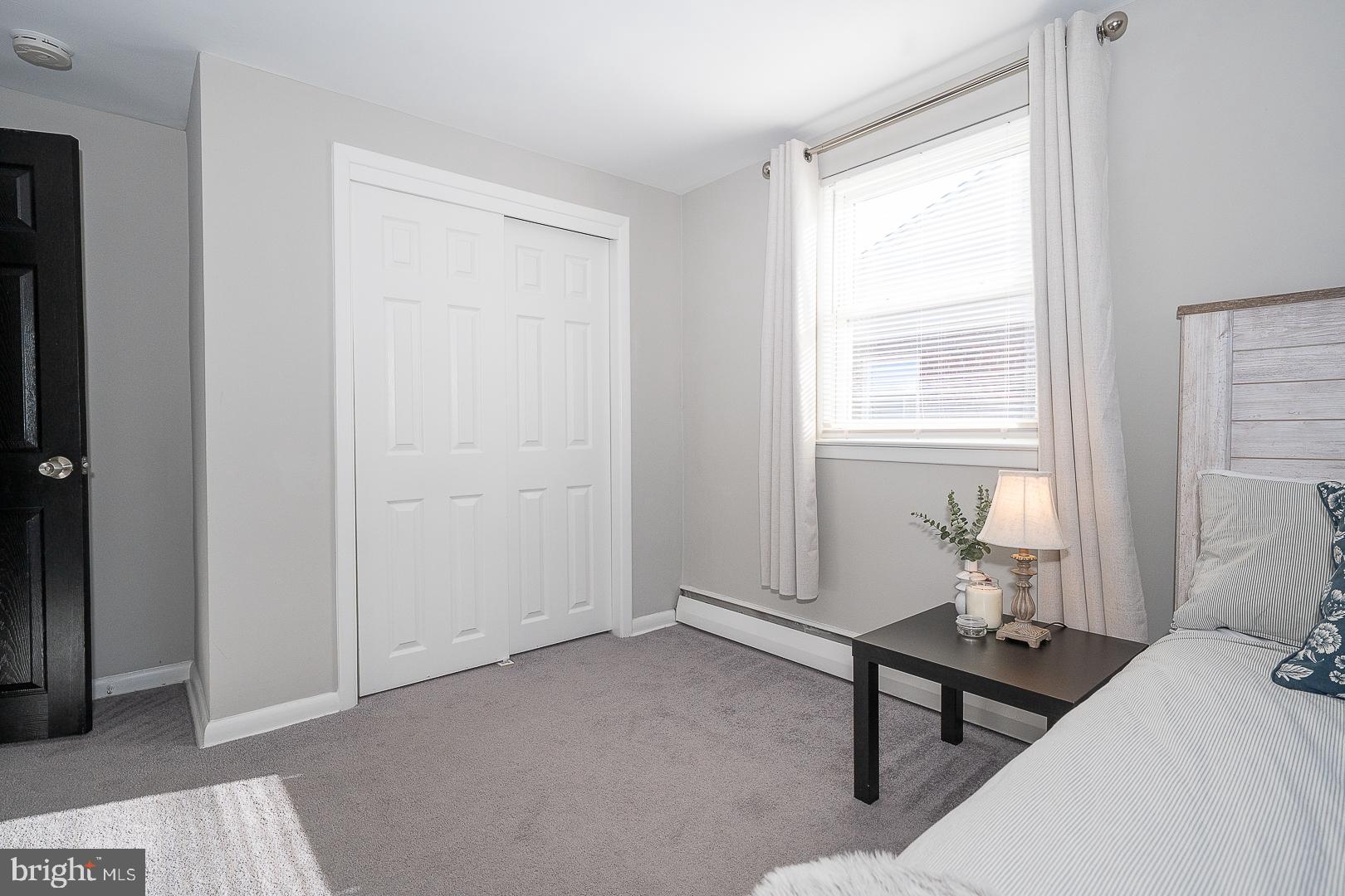 334 Parham Road Springfield, PA 19064 - Photo 26 of 45 a bedroom with a bed and a window