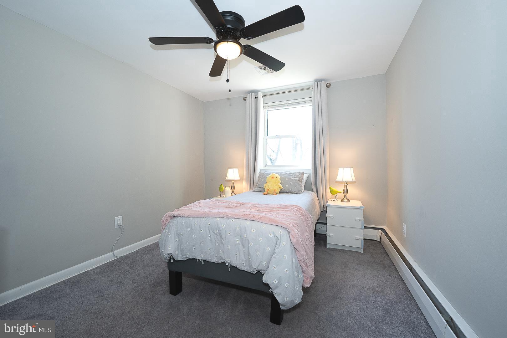334 Parham Road Springfield, PA 19064 - Photo 27 of 45 a bedroom with a bed and a window