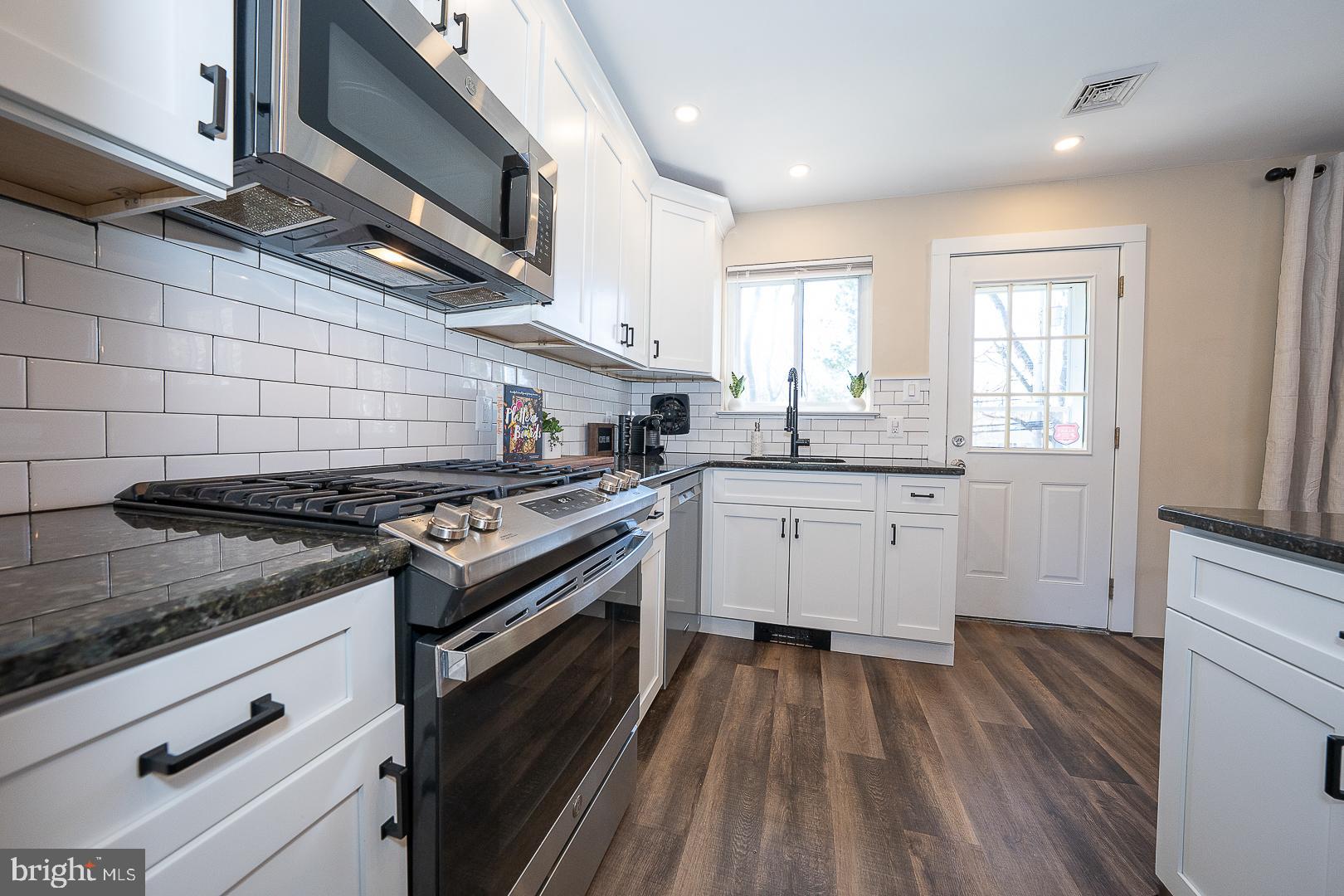 334 Parham Road Springfield, PA 19064 - Photo 10 of 45 a kitchen with a stove oven and sink