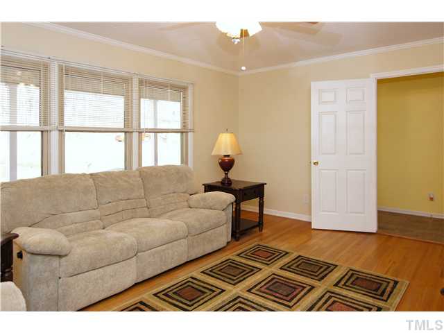933 Allister Road Durham, NC 27703 - Photo 3 of 20 Sun filled living room with hardwood floors, crown molding and updated paint.