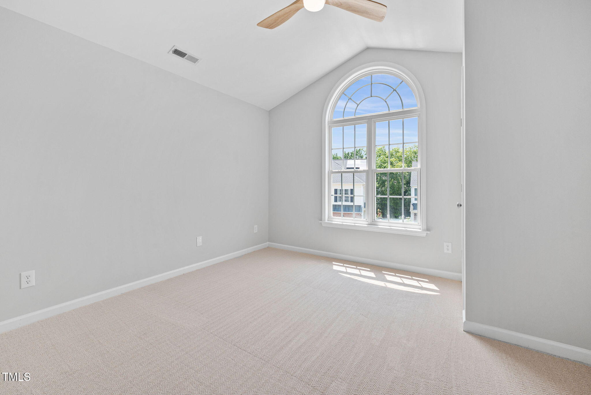 2040 Persimmon Ridge Drive Raleigh, NC 27604 - Photo 14 of 39 an empty room with windows and an outdoor space