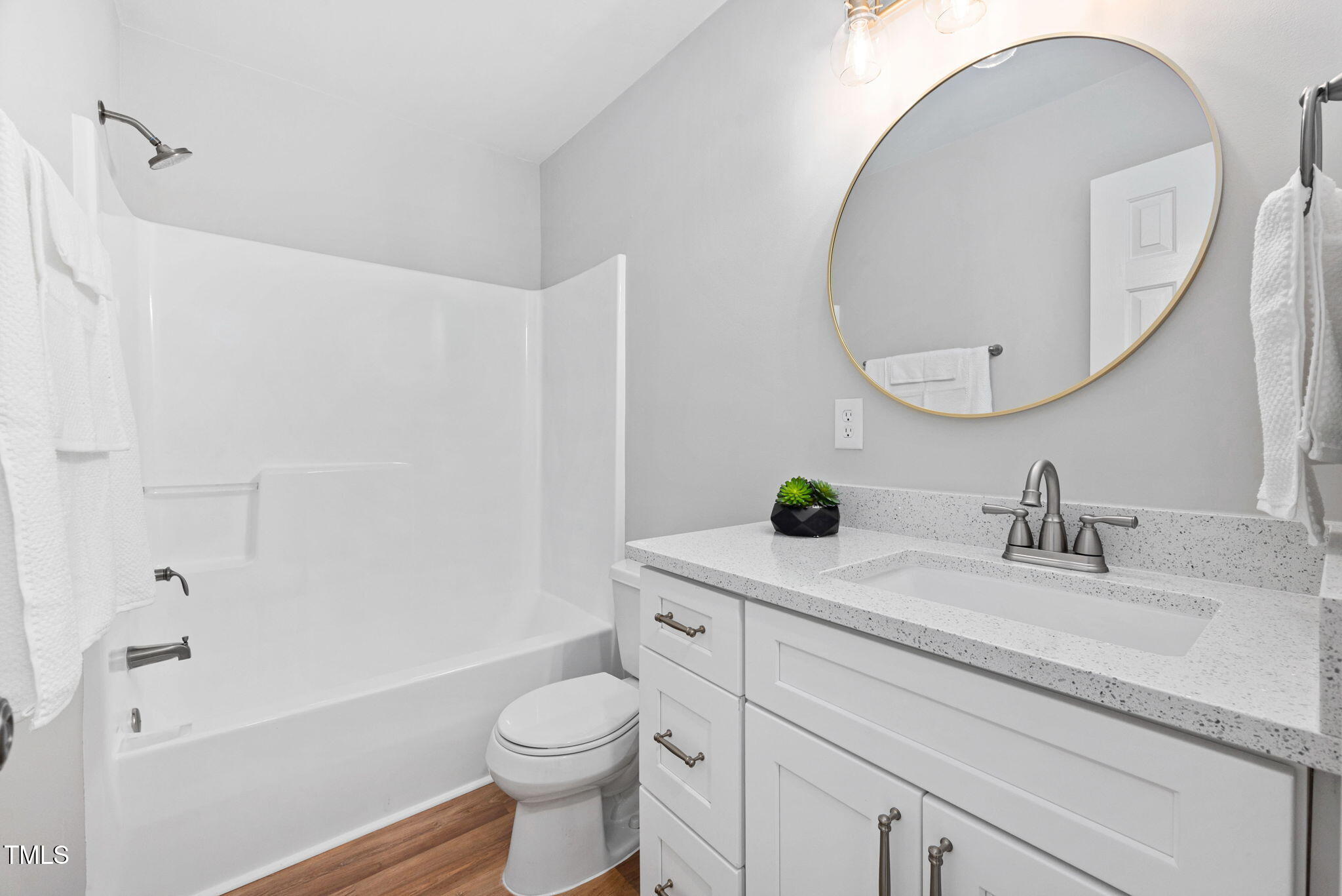 2040 Persimmon Ridge Drive Raleigh, NC 27604 - Photo 15 of 39 a bathroom with a sink a toilet and a mirror