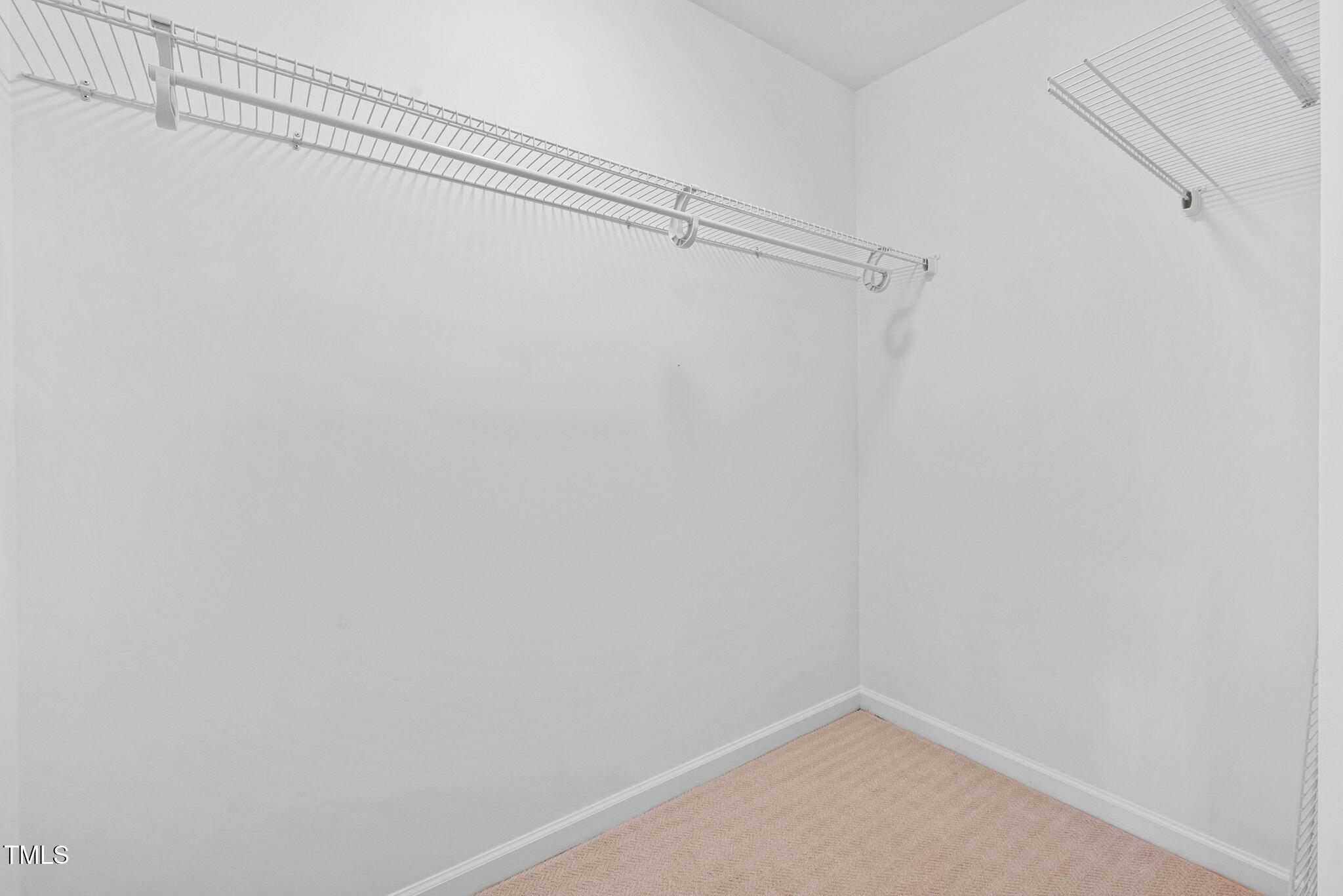 2040 Persimmon Ridge Drive Raleigh, NC 27604 - Photo 18 of 39 a view of a room with racks on the wall