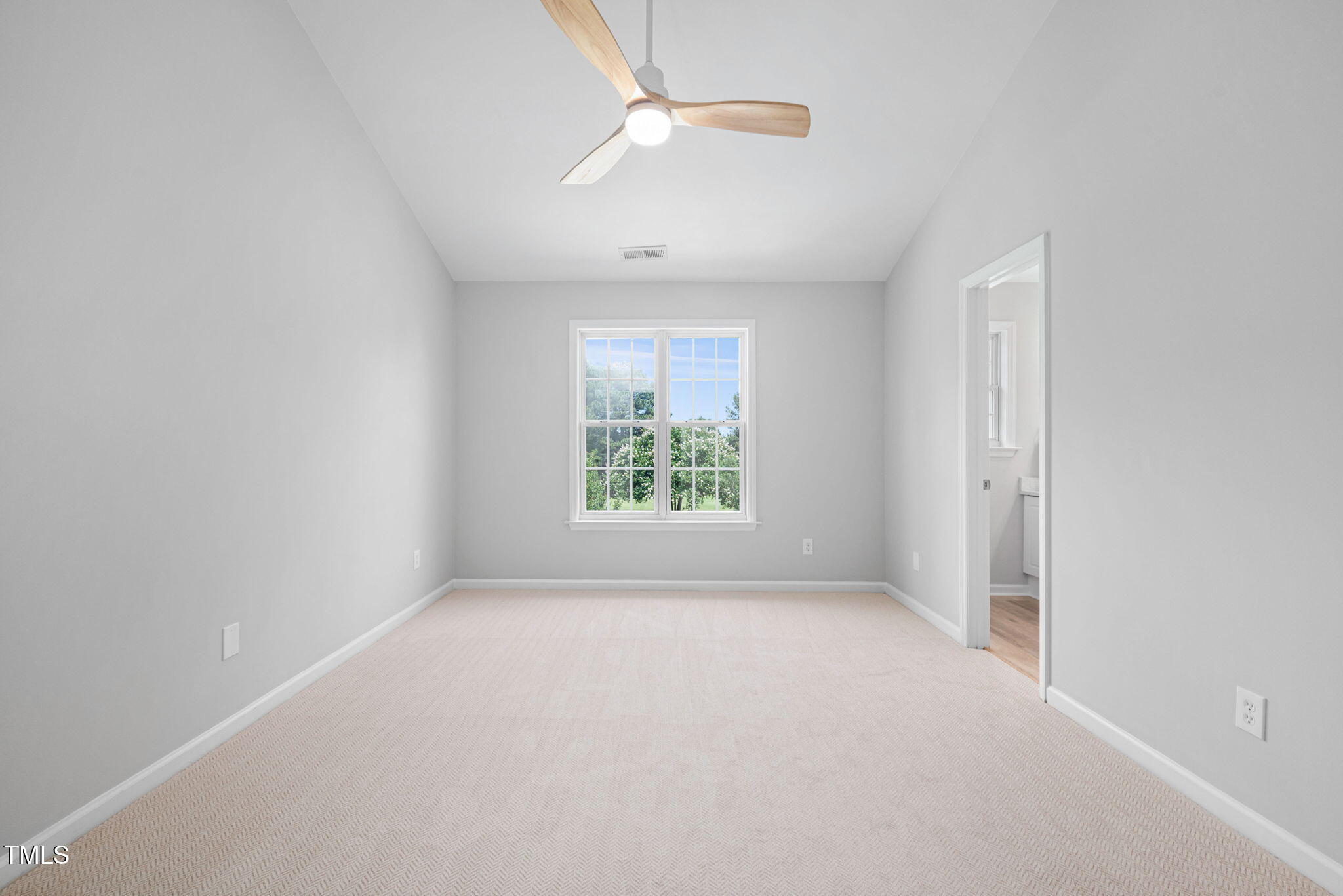 2040 Persimmon Ridge Drive Raleigh, NC 27604 - Photo 23 of 39 an empty room with a window and a fan