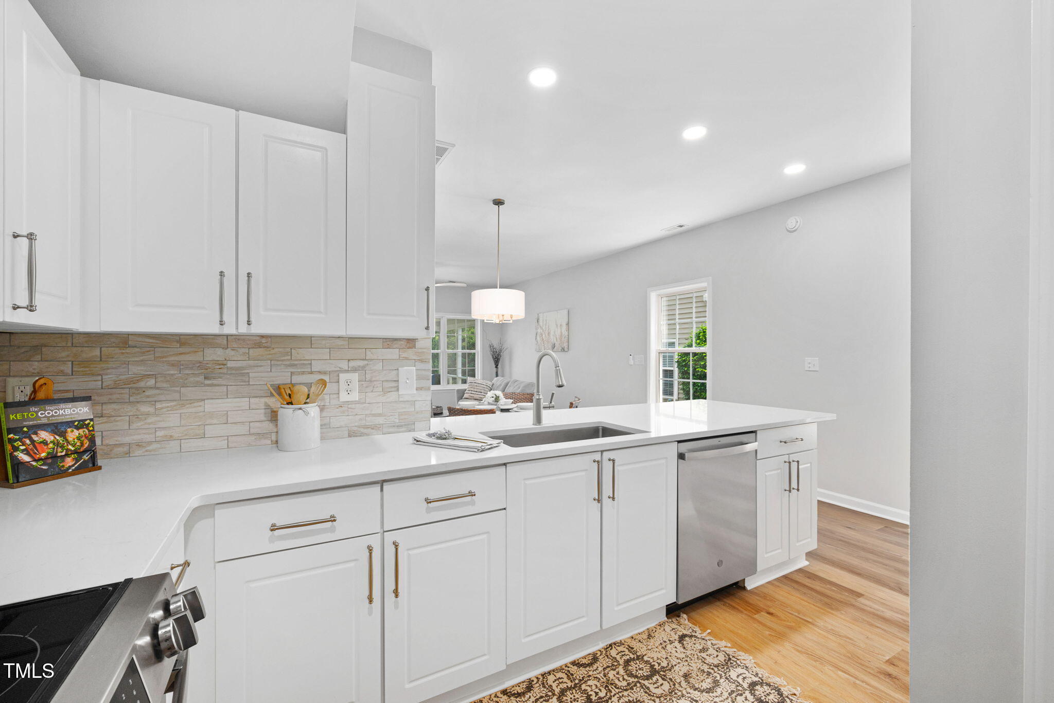2040 Persimmon Ridge Drive Raleigh, NC 27604 - Photo 3 of 39 a kitchen with a sink and cabinets