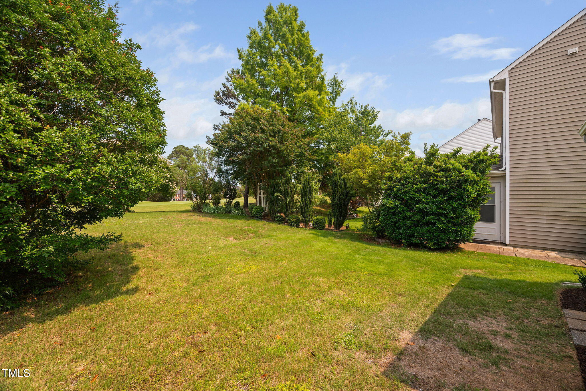 2040 Persimmon Ridge Drive Raleigh, NC 27604 - Photo 34 of 39 a view of yard with swimming pool and trees in the background