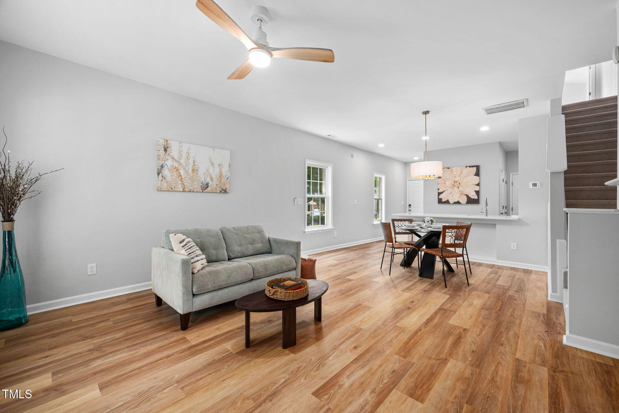 2040 Persimmon Ridge Drive Raleigh, NC 27604 - Photo 7 of 39 a living room with furniture and a wooden floor