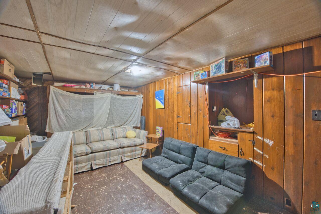 417 Arlington Road Hoyt Lakes, MN 55750 - Photo 17 of 32 Living area with wood walls and wood ceiling