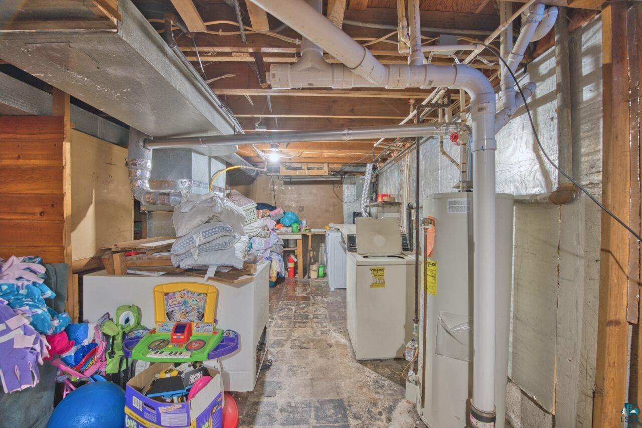 417 Arlington Road Hoyt Lakes, MN 55750 - Photo 20 of 32 Unfinished basement with gas water heater and washing machine and clothes dryer