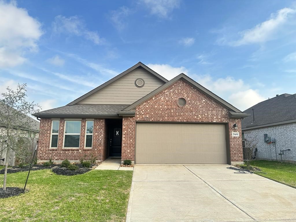 25406 Rustic Sq Trace Katy, TX 77493 - Photo 1 of 14 a front view of a house with a yard and garage