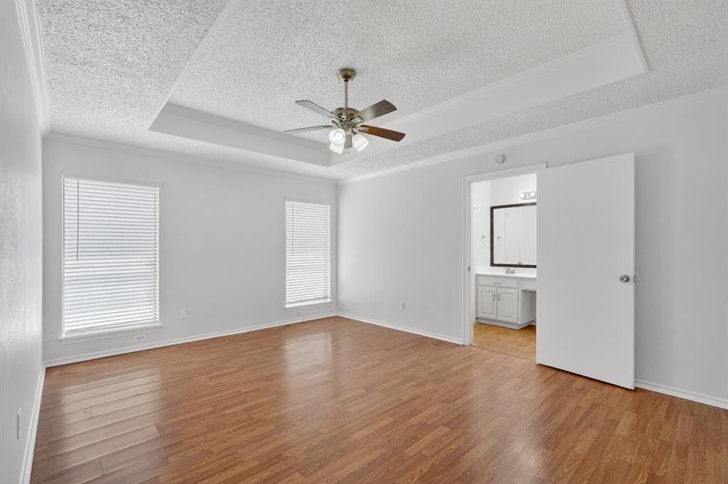 2403 Ridgevalley Drive McKinney, TX 75071 - Photo 11 of 21 a view of an empty room with a window and wooden floor