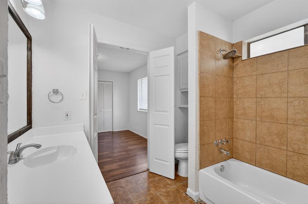 2403 Ridgevalley Drive McKinney, TX 75071 - Photo 19 of 21 a bathroom with a bathtub a toilet and a shower