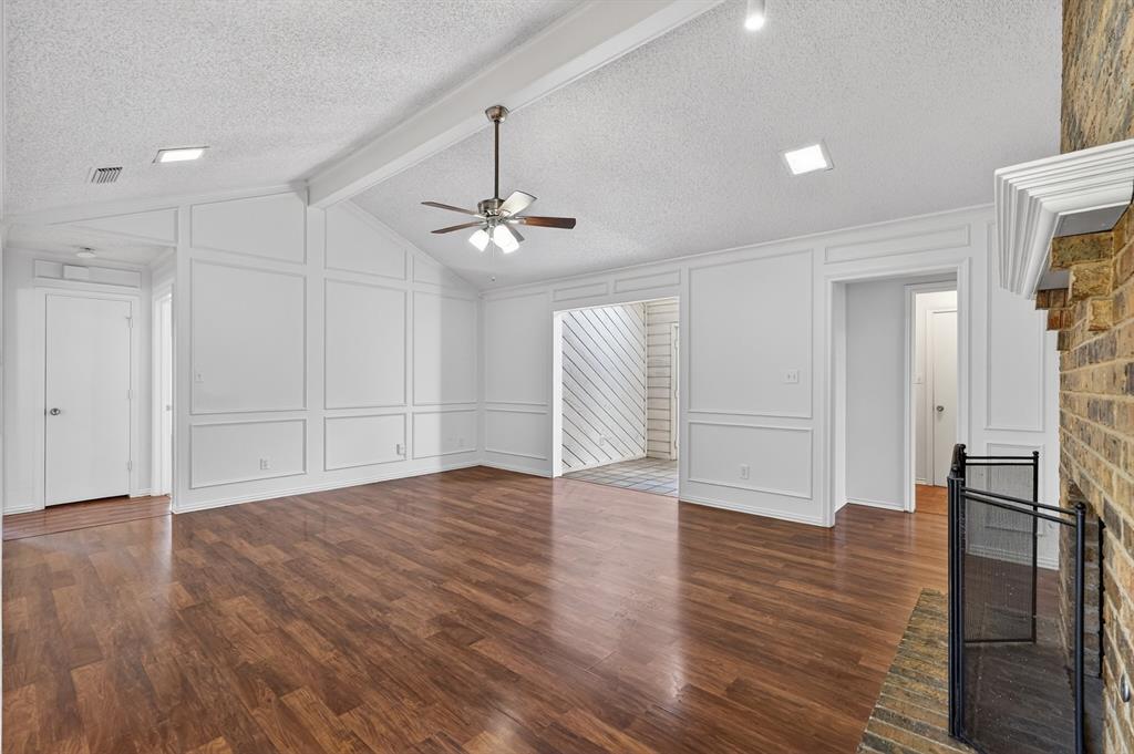 2403 Ridgevalley Drive McKinney, TX 75071 - Photo 3 of 21 a view of an empty room with wooden floor fridge and a window
