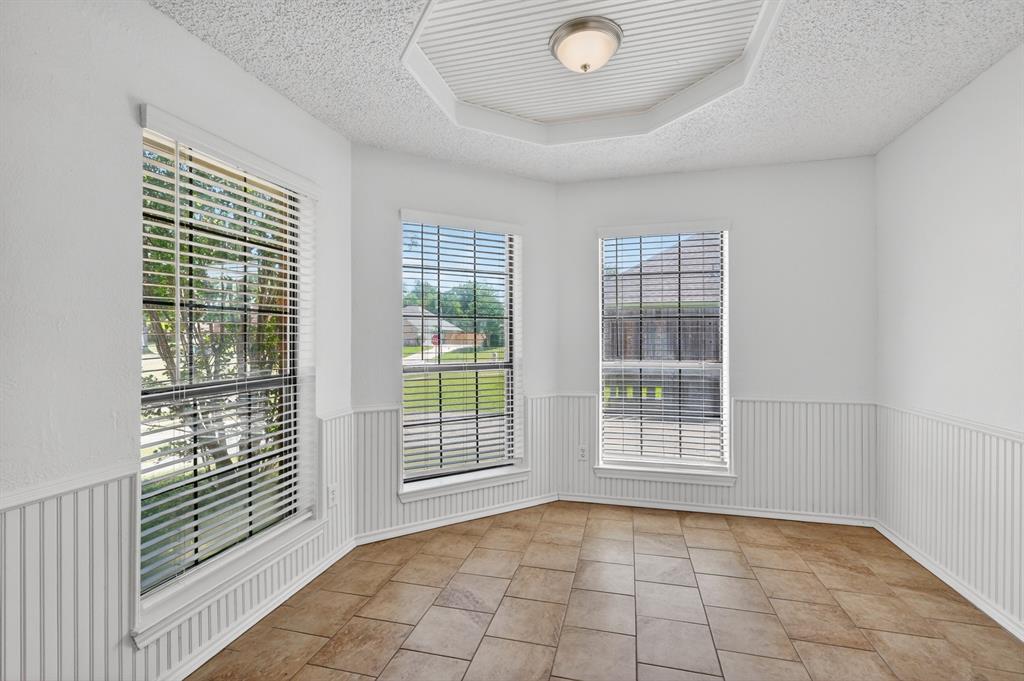 2403 Ridgevalley Drive McKinney, TX 75071 - Photo 4 of 21 a view of an empty room with glass door