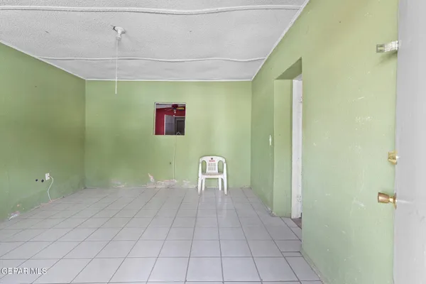 a view of a hallway with seating area