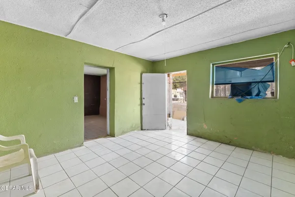 a bedroom with a bed and a mirror