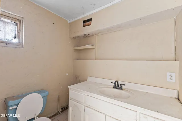 a bathroom with a sink and a toilet