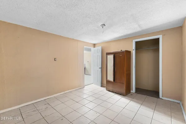a room with a sink and a mirror
