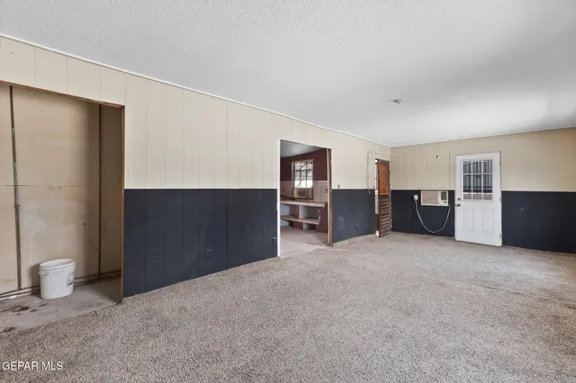 a view of an empty room and window