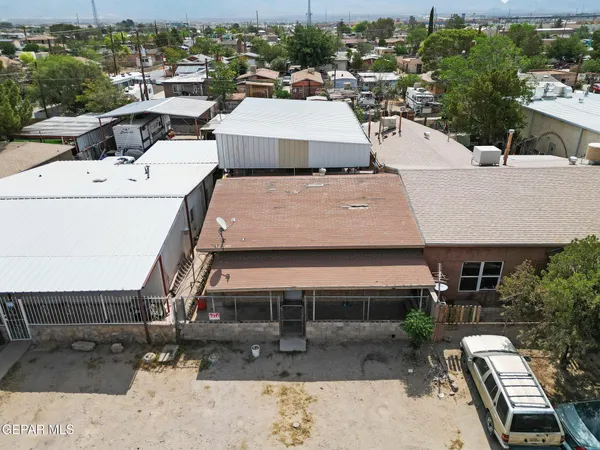 an aerial view of a house with garden space and sitting space
