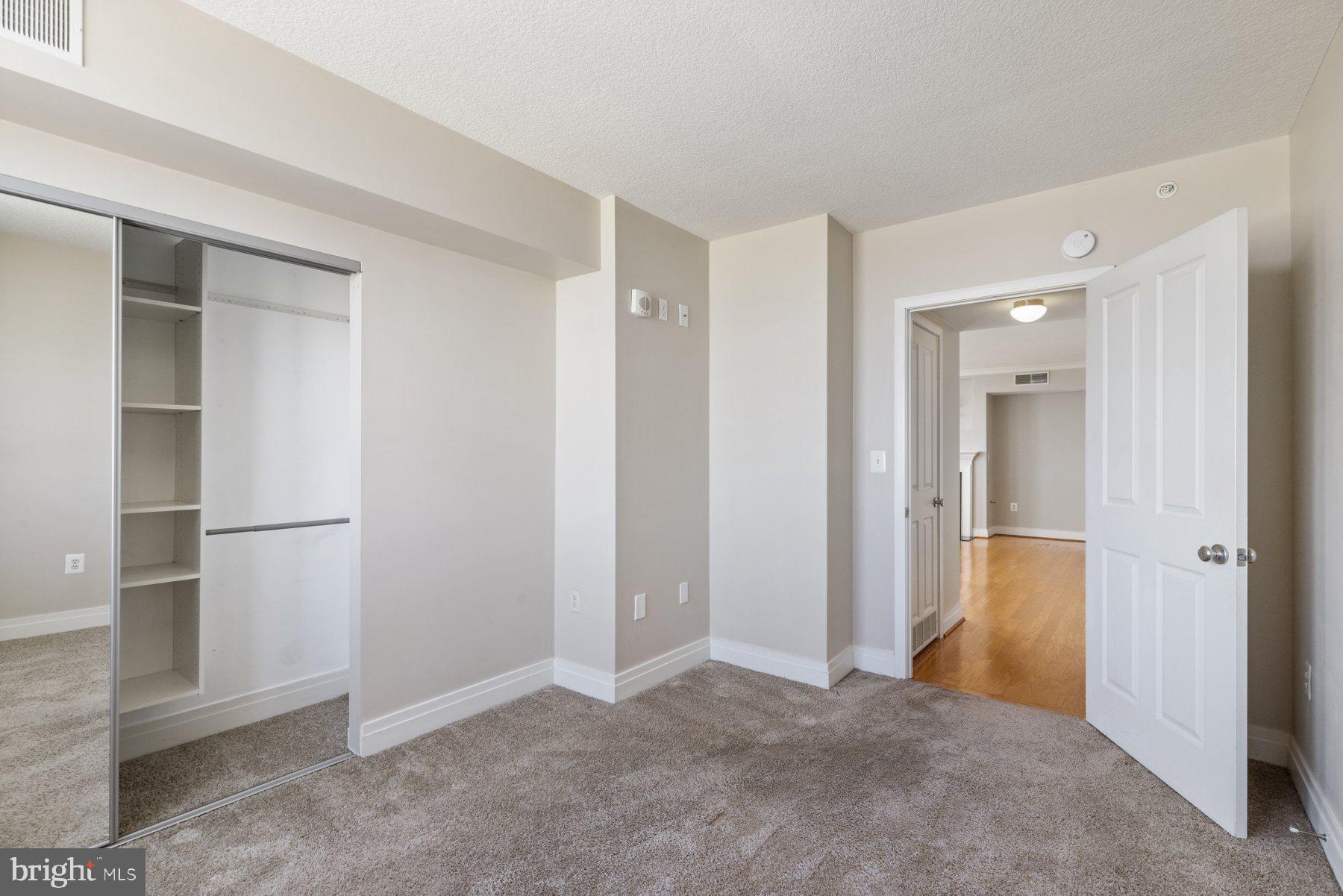 414 Water Street, Unit 2512 Baltimore, MD 21202 - Photo 22 of 40 an empty room with closet