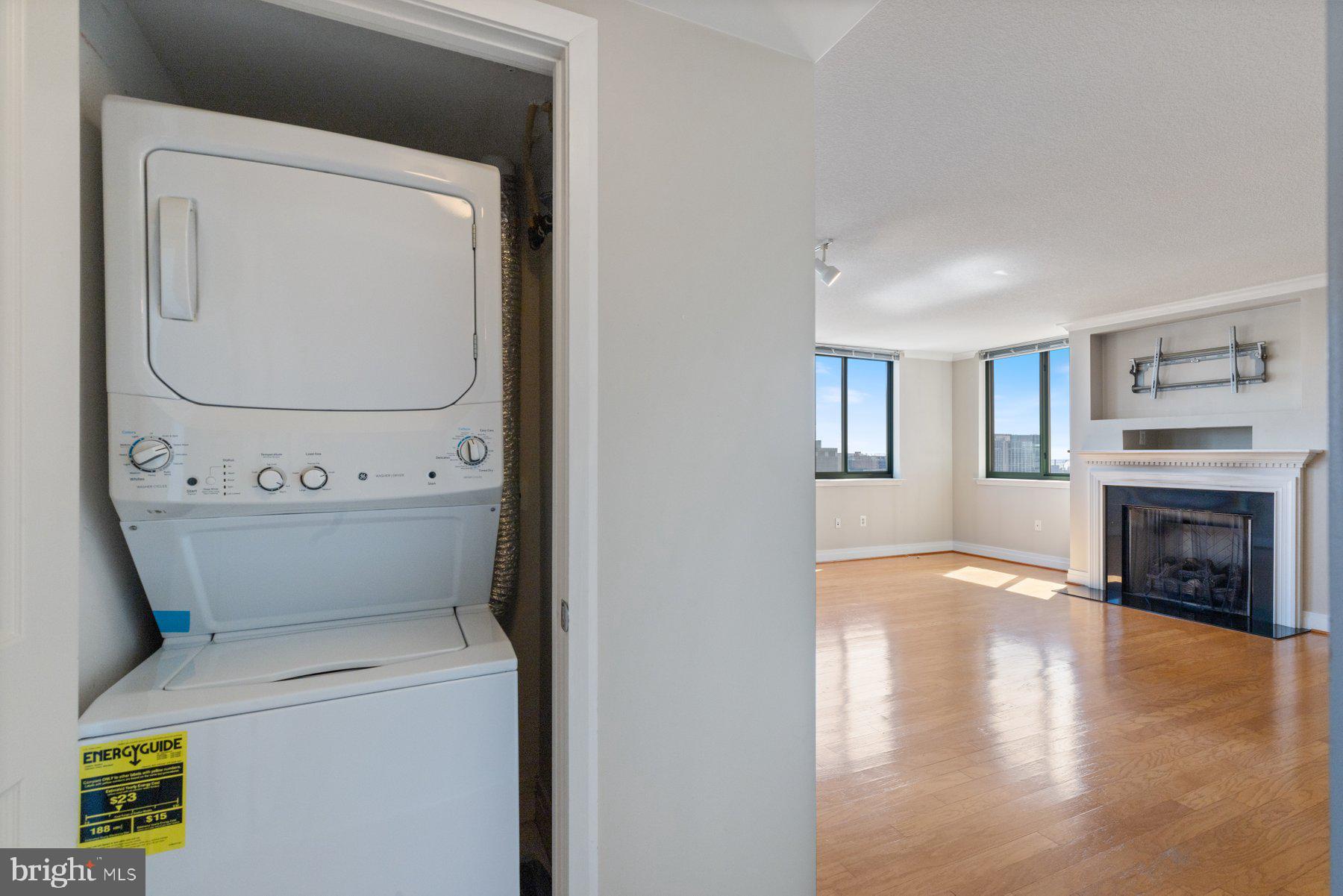 414 Water Street, Unit 2512 Baltimore, MD 21202 - Photo 25 of 40 a view of washer and dryer with wooden floor