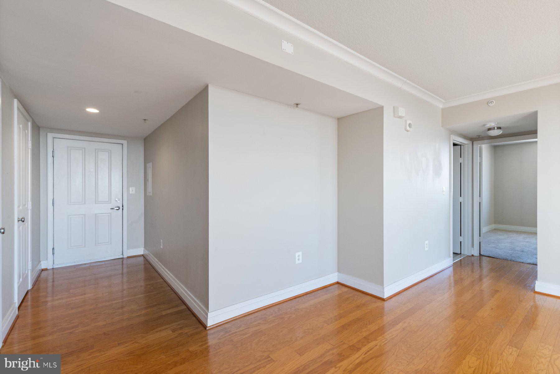 414 Water Street, Unit 2512 Baltimore, MD 21202 - Photo 26 of 40 a view of hallway with wooden floor