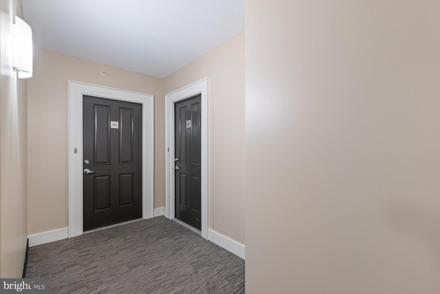 414 Water Street, Unit 2512 Baltimore, MD 21202 - Photo 27 of 40 a view of hallway with wooden floor