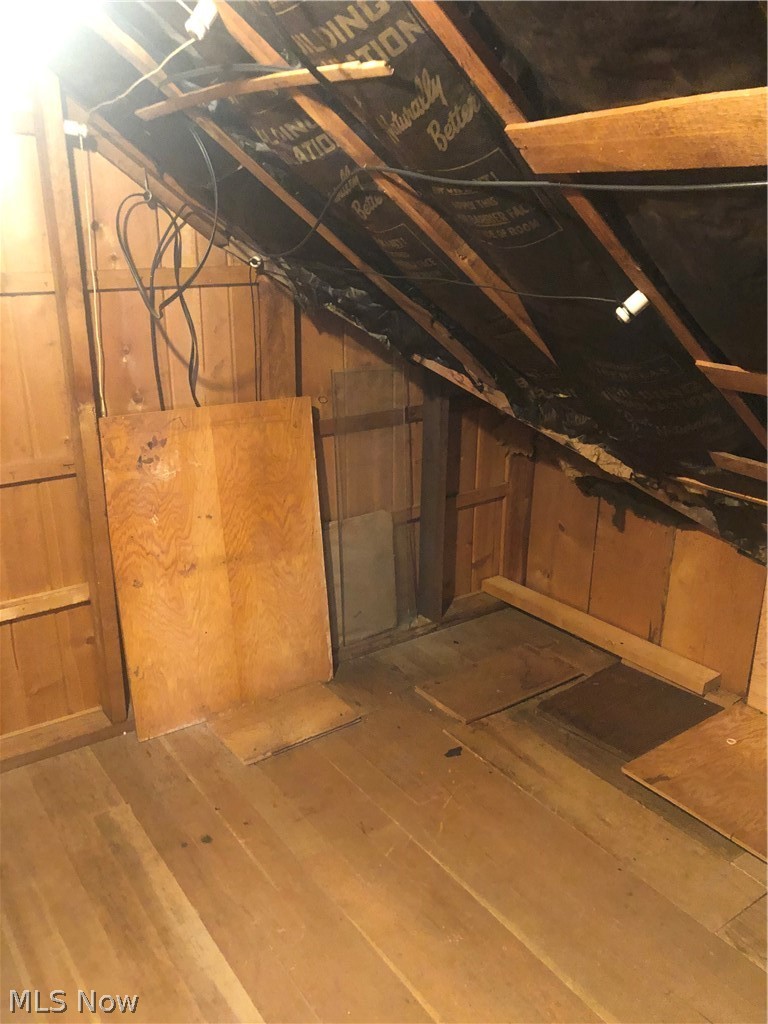 4037 Wilmington Road Cleveland, OH 44121 - Photo 28 of 36 Basement featuring wood walls and hardwood / wood-style floors