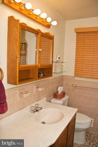 9824 Gunforge Road Perry Hall, MD 21128 - Photo 12 of 20 main level bathroom with skylite