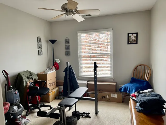 a livingroom with workspace and a couch