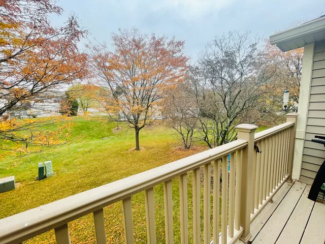 a view of a balcony with trees