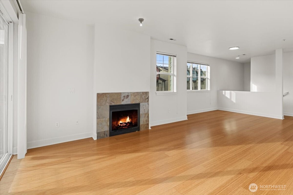 19102 20th Drive Southeast, Unit B206 Bothell, WA 98012 - Photo 11 of 39 a view of an empty room with a window and fireplace