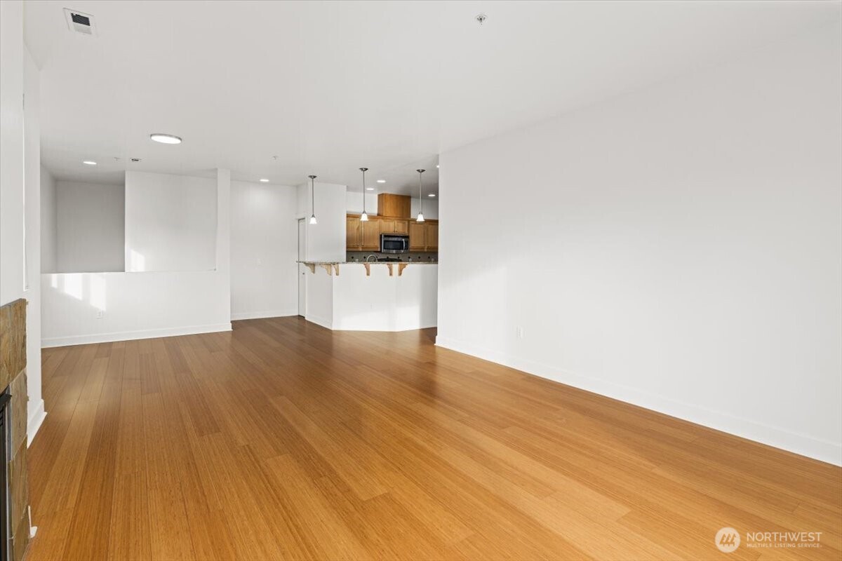 19102 20th Drive Southeast, Unit B206 Bothell, WA 98012 - Photo 13 of 39 a view of empty room with wooden floor