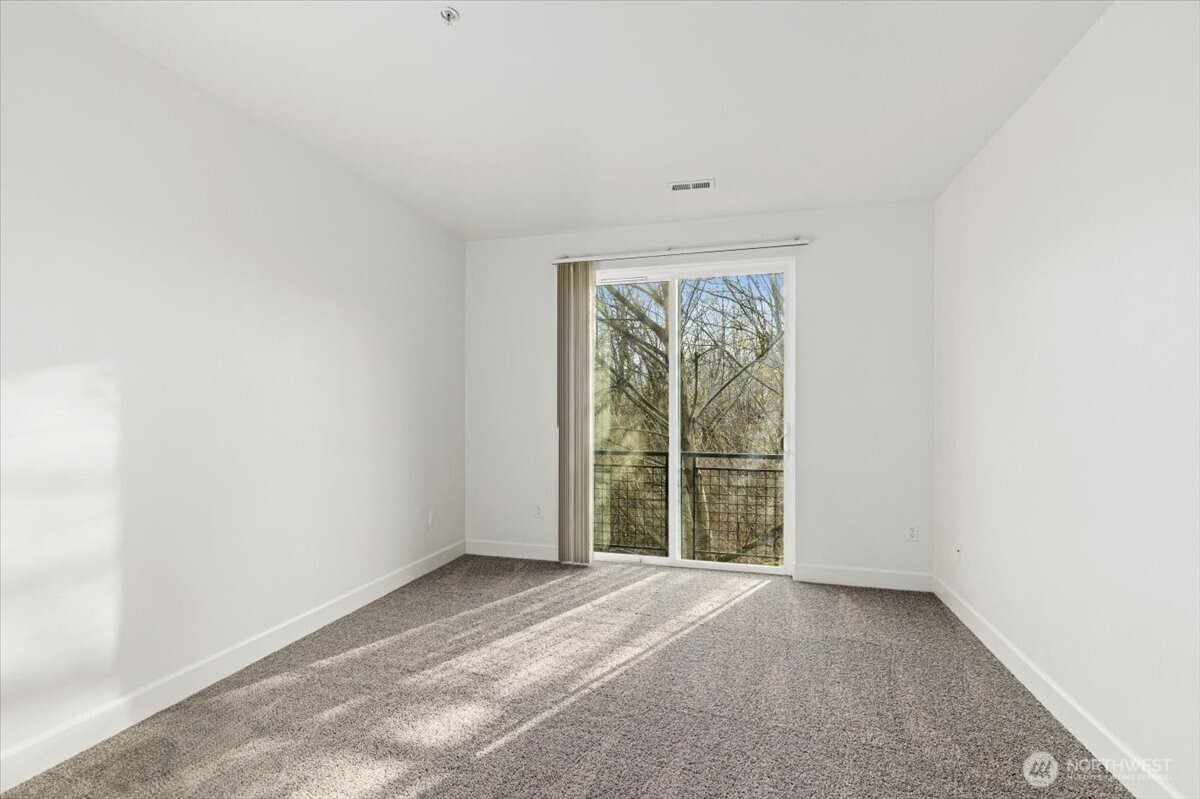19102 20th Drive Southeast, Unit B206 Bothell, WA 98012 - Photo 23 of 39 a view of an empty room with a window