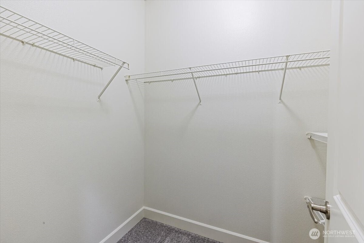 19102 20th Drive Southeast, Unit B206 Bothell, WA 98012 - Photo 26 of 39 a view of a room with racks on the wall
