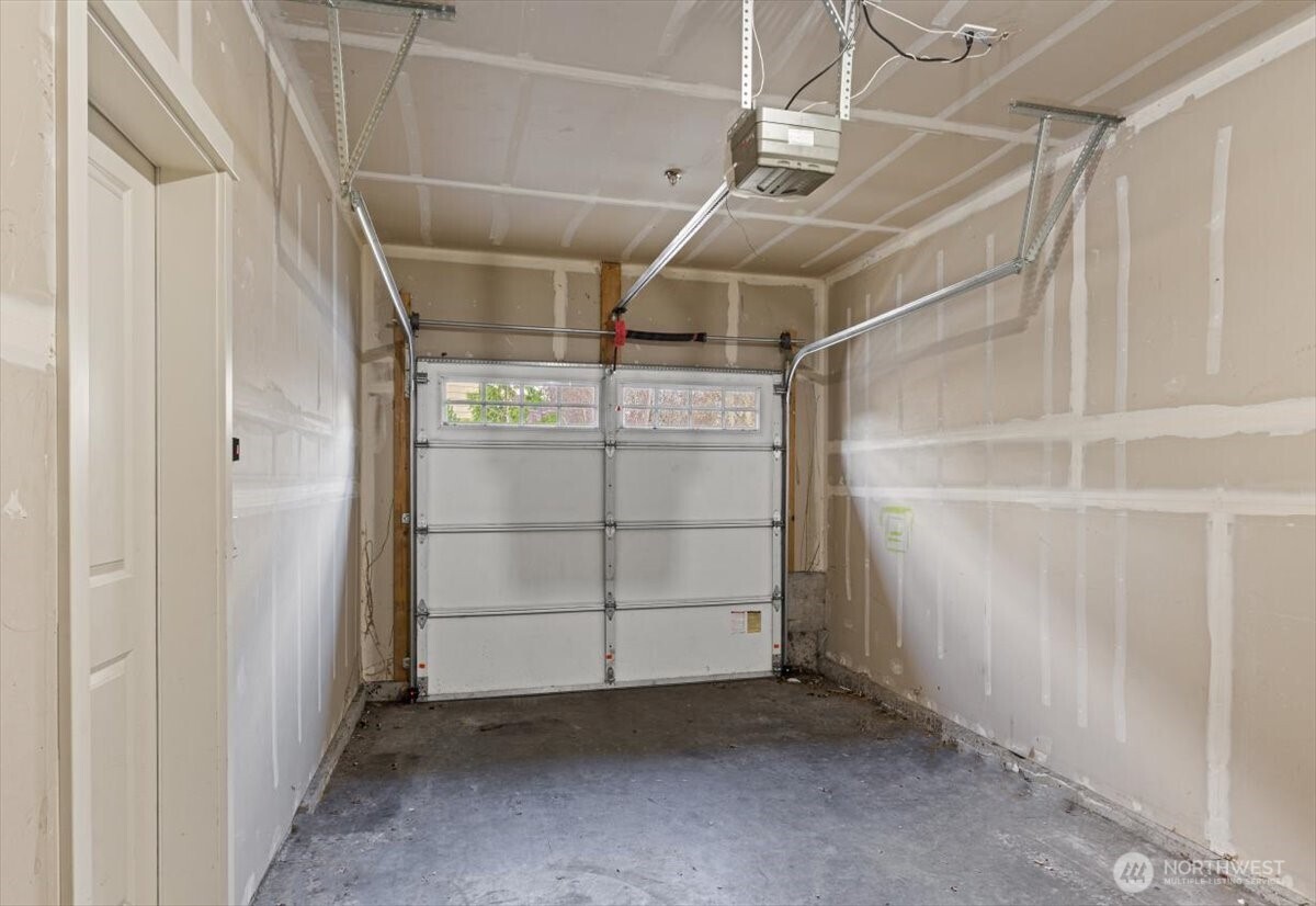 19102 20th Drive Southeast, Unit B206 Bothell, WA 98012 - Photo 5 of 39 a view of a room with racks on the wall