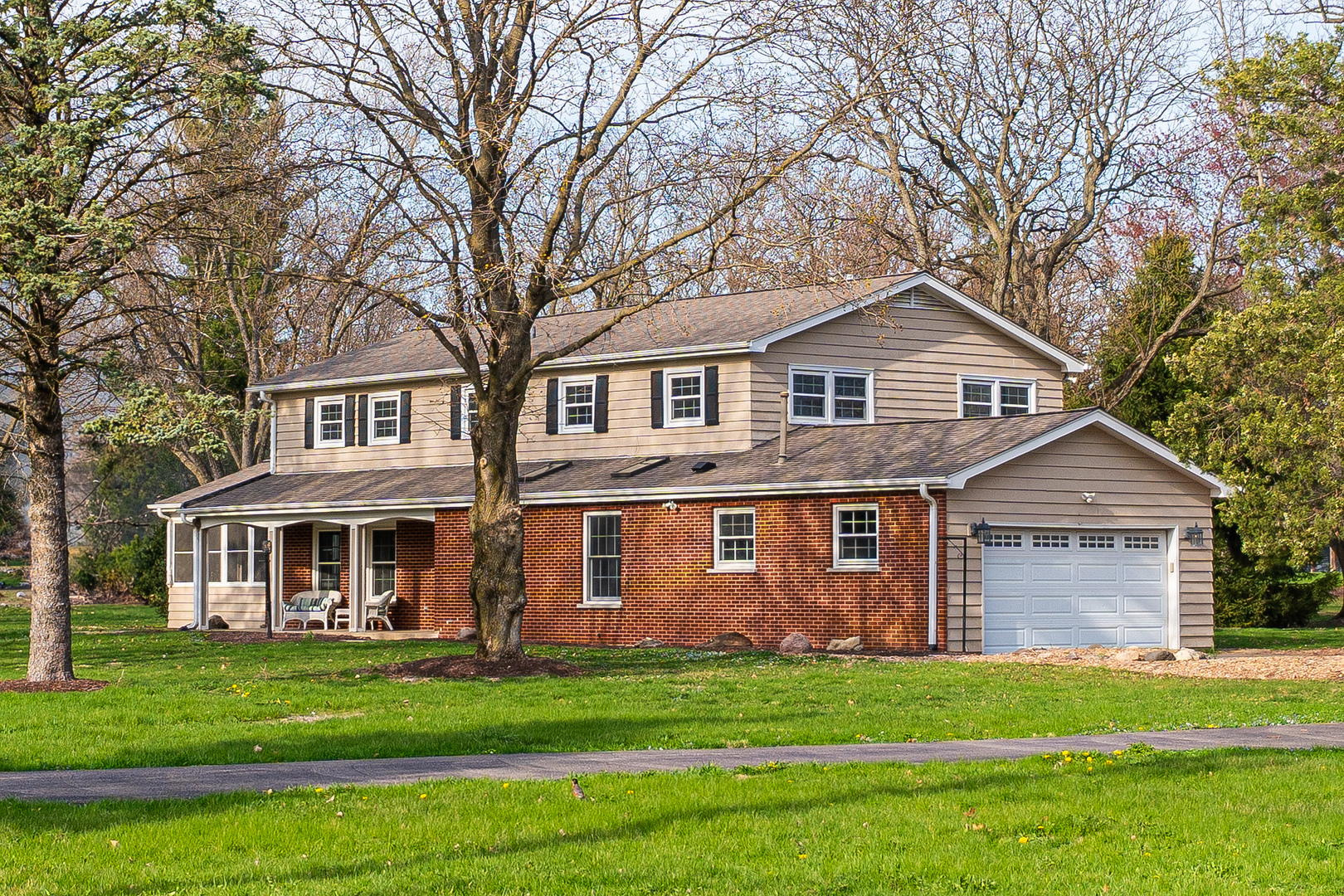 2S739 Nelson Lake Road Batavia, IL 60510 - Photo 2 of 65 a front view of a house with a garden
