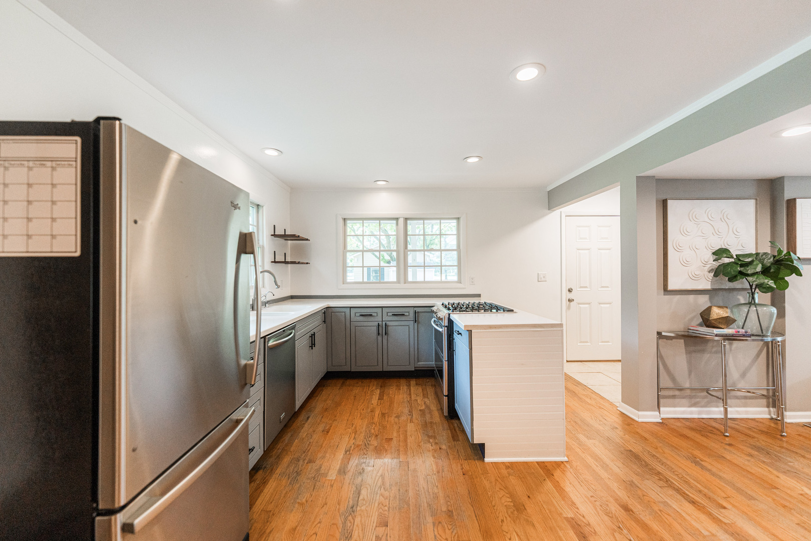 2S739 Nelson Lake Road Batavia, IL 60510 - Photo 21 of 65 a kitchen with a refrigerator and a wooden floor