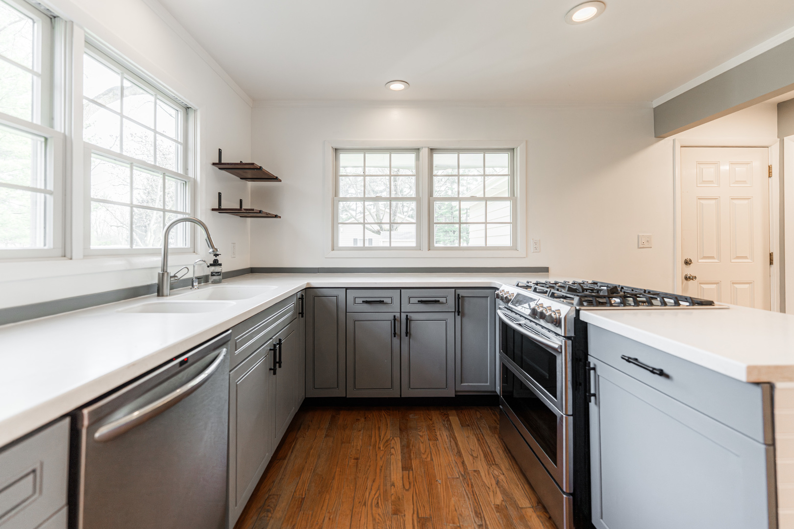 2S739 Nelson Lake Road Batavia, IL 60510 - Photo 25 of 65 a kitchen with granite countertop a sink appliances wooden floor and a window